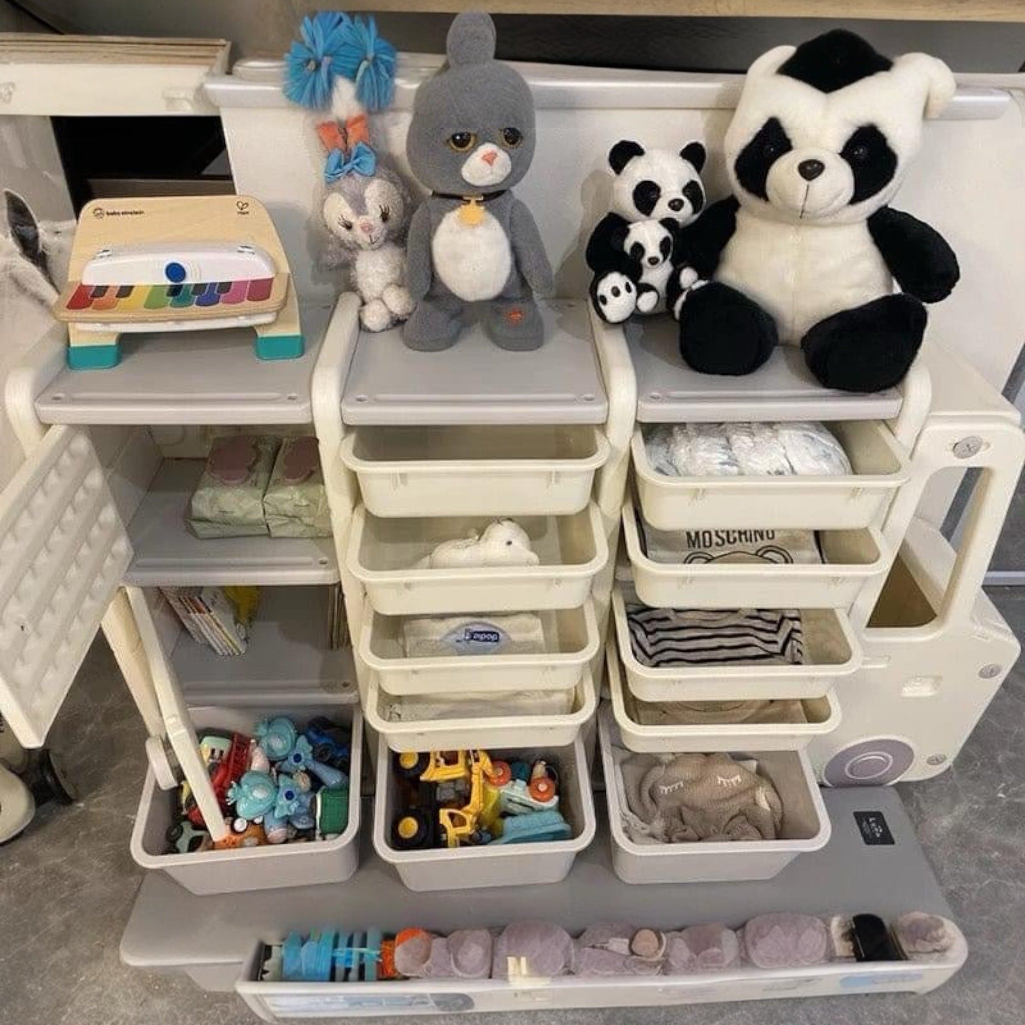 “Children’s toy organizer in the shape of a bus with multiple storage bins”