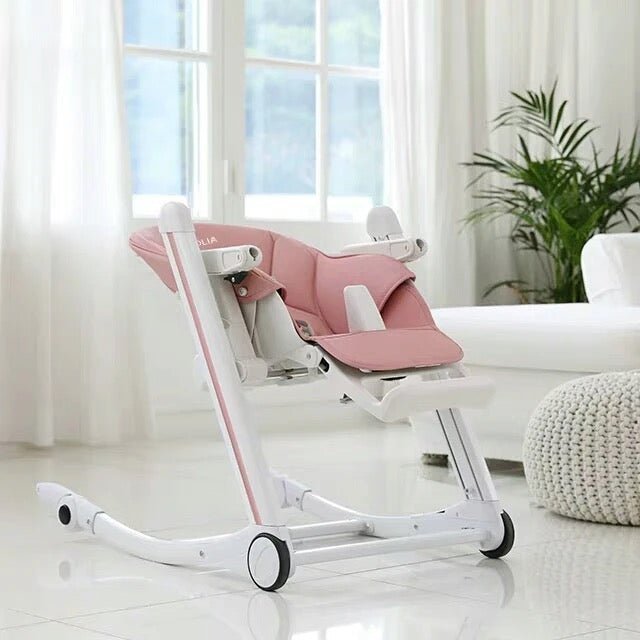 Luxury baby high chair that converts into a rocker with 5-point harness and wheels for easy movement