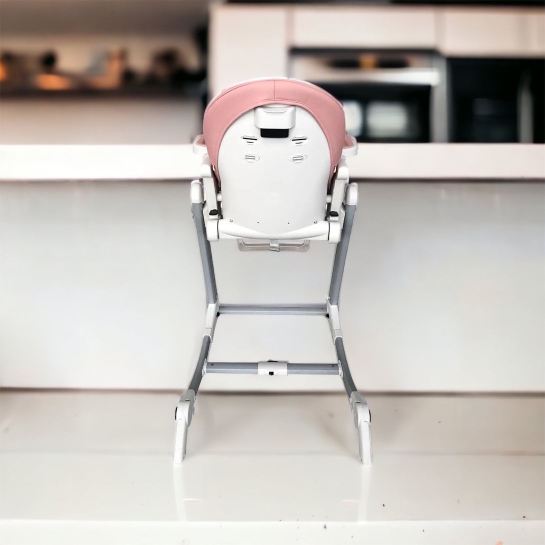 Luxury baby high chair that converts into a rocker with 5-point harness and wheels for easy movement