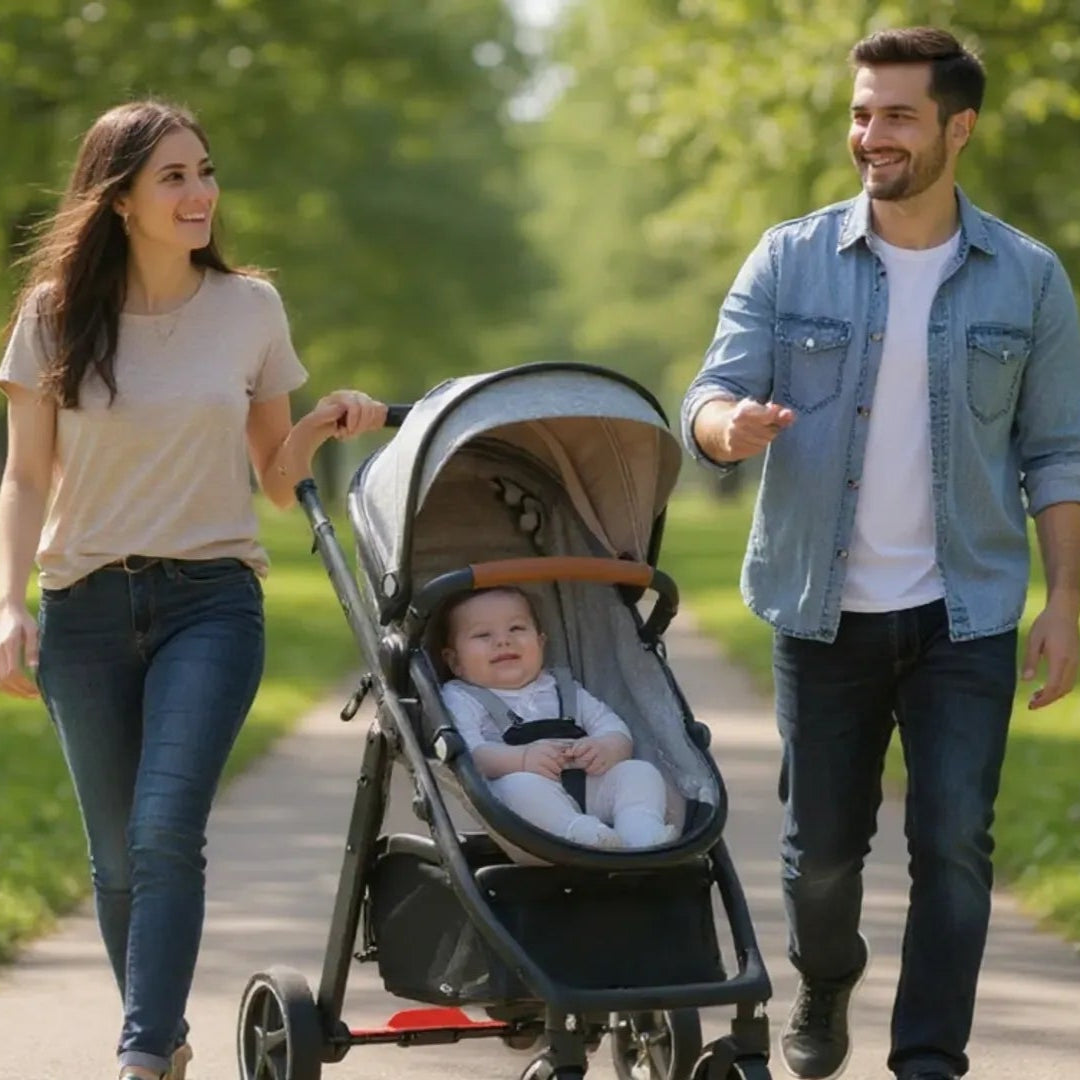 Family walking with a stroller in a park